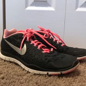 Black and neon pink Nikes